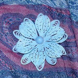 Vintage blue celluloid flower brooch